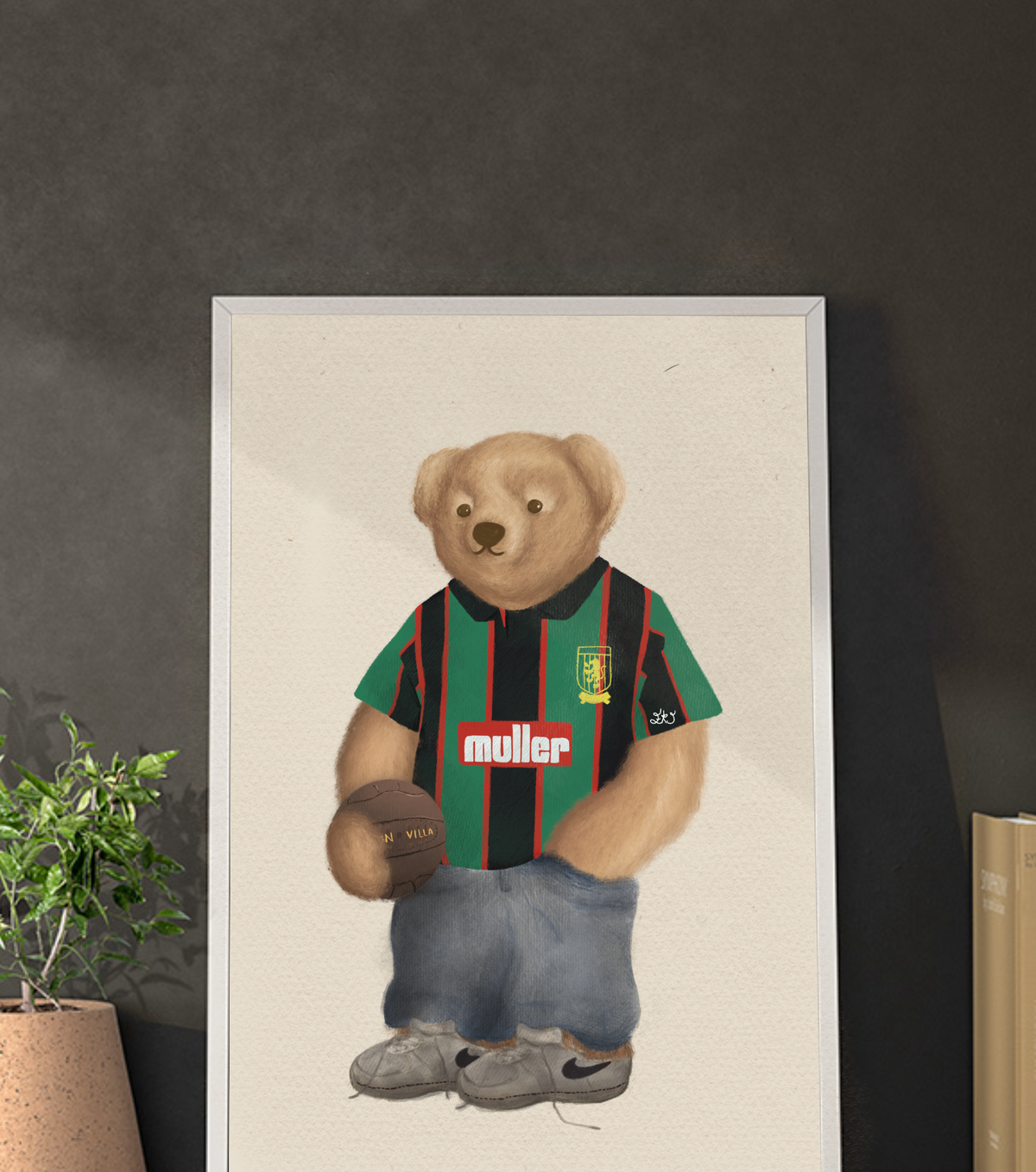 Poster of a teddy bear wearing a saston villa ports jersey with visible branding on a dark wall.