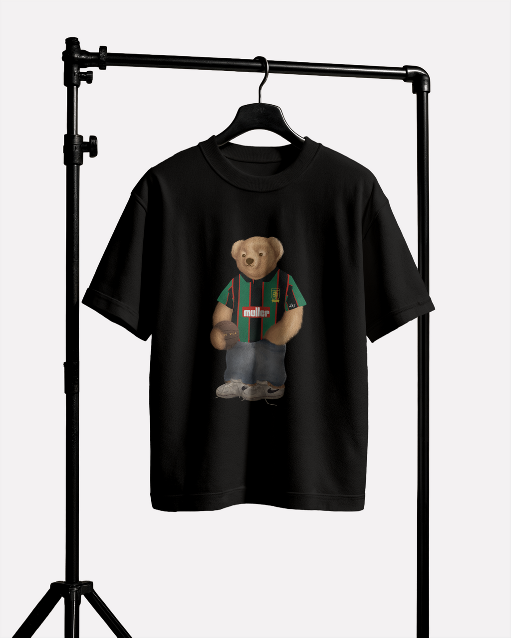 Black t-shirt with a Aston Villa teddy bear graphic on a black stand against a white background